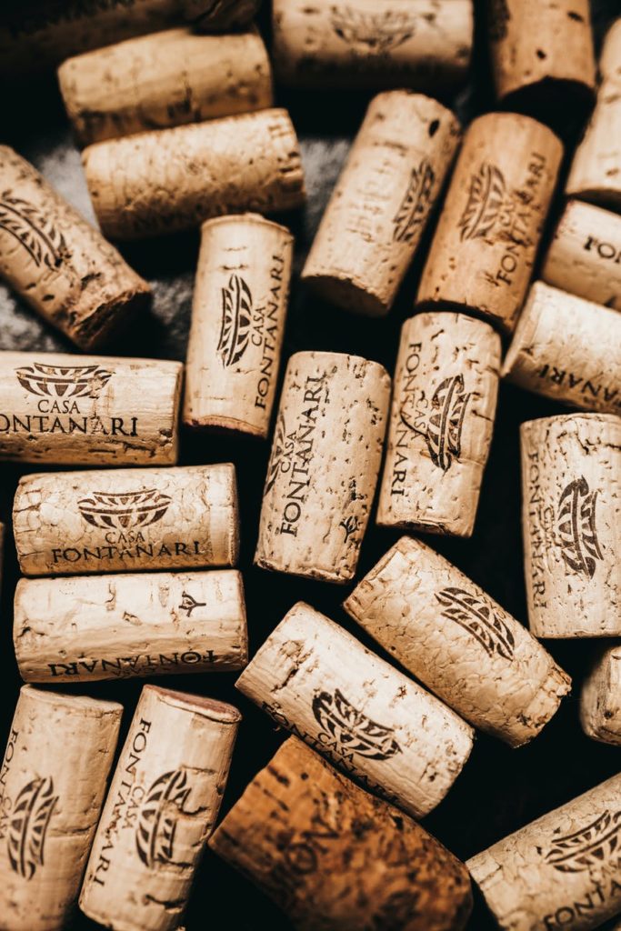 pile of wooden stoppers with inscription